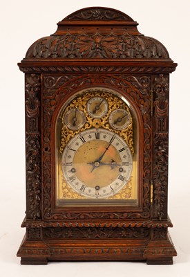 Lot 492 - A late 19th Century carved walnut eight-day bracket clock