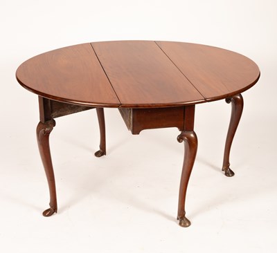 Lot 382 - A George III mahogany oval two-flap table