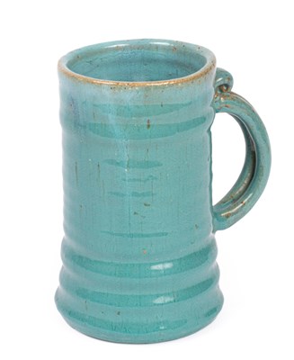 Lot 104 - A turquoise glazed ribbed tankard