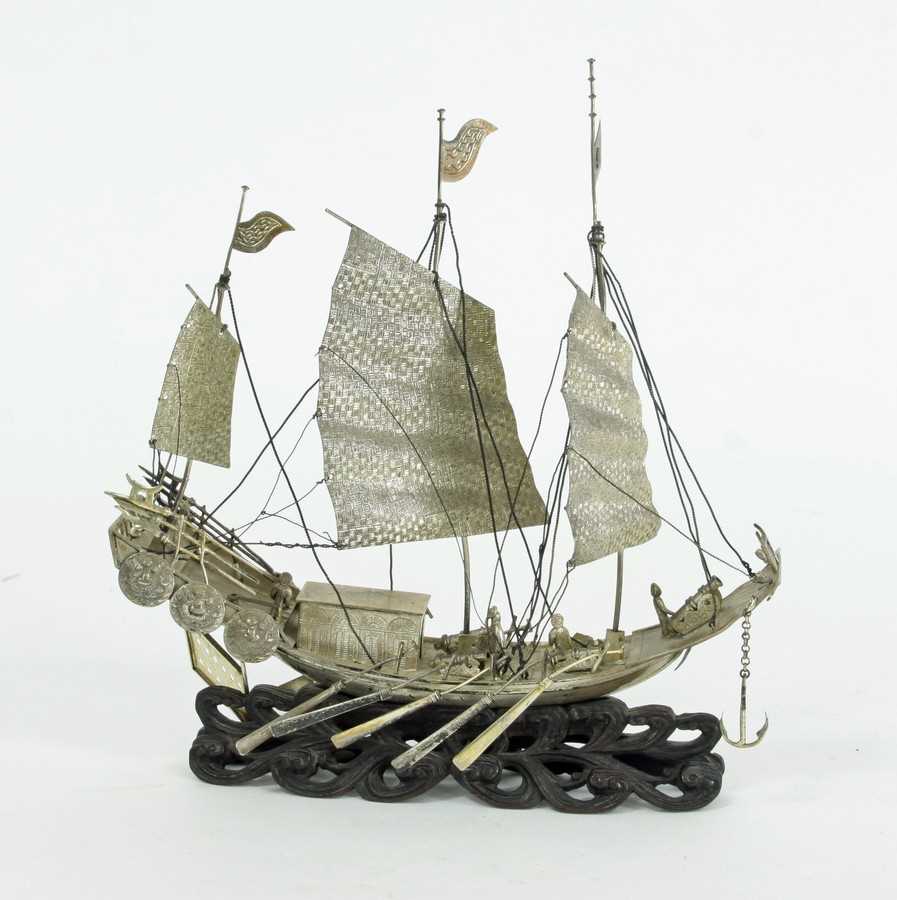 Lot 444 - A Chinese white metal model of a junk, Hung...