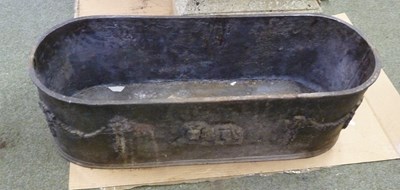 Lot 3 - An oval lead planter with swags to the ends...