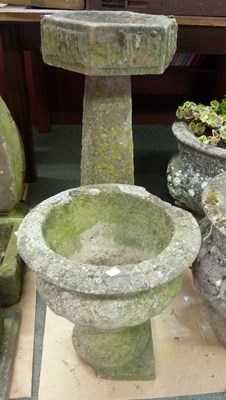 Lot 9 - A reconstituted stone bird bath, 77cm high and...