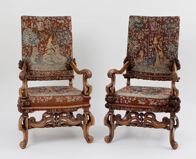 Lot 42 - A pair of walnut upholstered armchairs of...