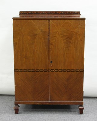 Lot 44 - A walnut millinery cupboard, fitted sliding...