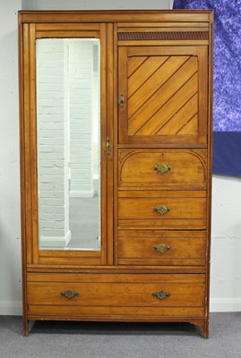 Lot 61 - An Edwardian pitch pine mirror fronted...