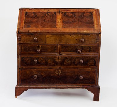 Lot 89 - A George I walnut and feather-banded bureau,...