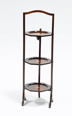 Lot 103 - An Edwardian mahogany three-tier folding cake...