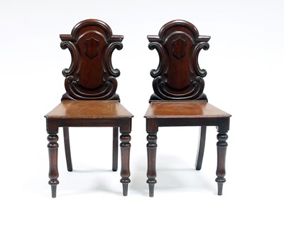 Lot 106 - A pair of Victorian hall chairs with carved...