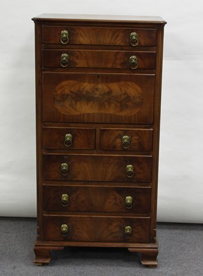 Lot 125 - A mahogany chest with drawers and fall front,...