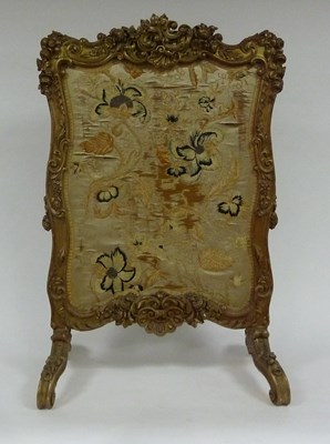 Lot 126 - A carved gilt wood framed fire-screen of...