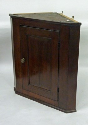 Lot 130 - A 19th Century oak corner cupboard enclosed by...