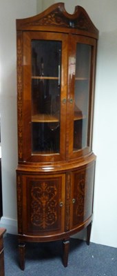 Lot 144 - A mahogany corner cupboard of Edwards &...