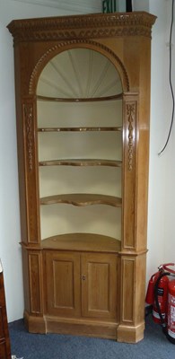 Lot 146 - A pine corner cupboard with open shelves over,...