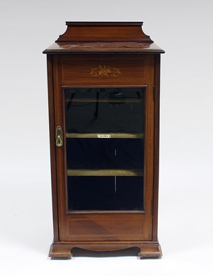 Lot 148 - An Edwardian mahogany music cabinet, cross...