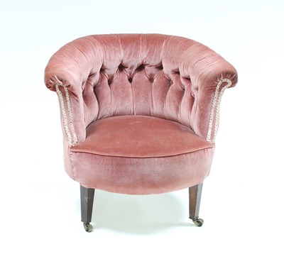 Lot 174 - A tub shaped armchair with deep buttoned back...