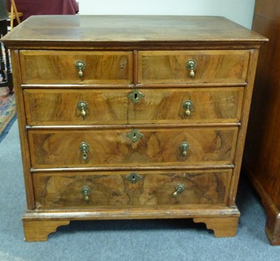 Lot 183 - An early 18th Century walnut chest, fitted...