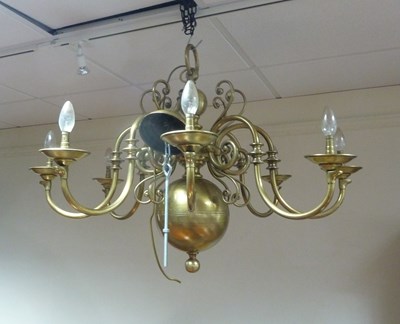 Lot 185 - A Dutch brass eight-light chandelier, with...