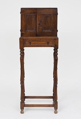 Lot 195 - A 17th Century oak spice cupboard on later...