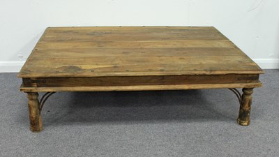 Lot 204 - An Indian coffee table on turned legs with...