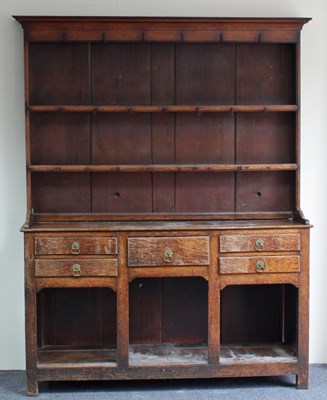 Lot 211 - A late 18th Century oak dresser, the closed...