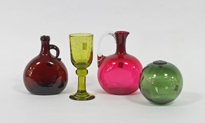 Lot 222 - A green glass float, a ruby tinted glass...