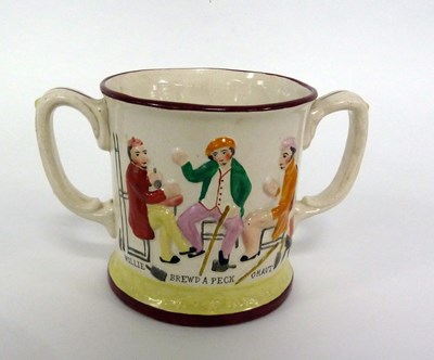 Lot 243 - A Staffordshire two-handled frog mug, tavern...