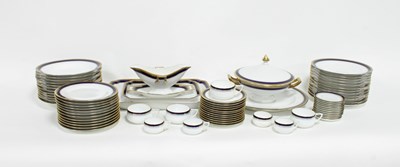 Lot 253 - A German porcelain dinner service, with cobalt...