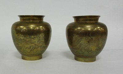 Lot 266 - A pair of Tibetan engraved brass vases, 15cm high