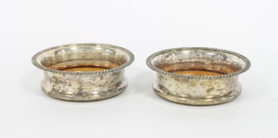 Lot 453 - A pair of plated magnum coasters, with gadroon...