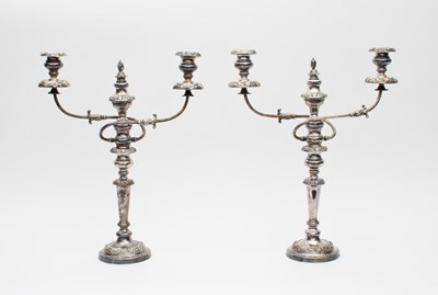 Lot 454 - A pair of silver plated two-branch three-light...