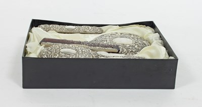 Lot 467 - A four-piece silver backed dressing set,...