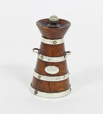 Lot 503 - A silver mounted pepper mill of butter-churn...