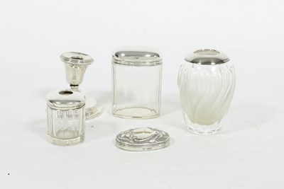 Lot 530 - Two silver mounted glass jars, a silver lid...