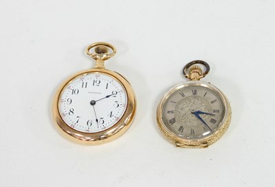 Lot 550 - A 14k gold cased open-faced pocket watch, the...