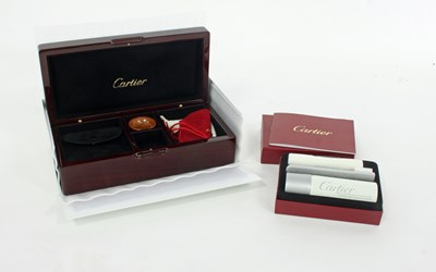 Lot 579 - A Cartier jewellery care kit, the hinged lid...