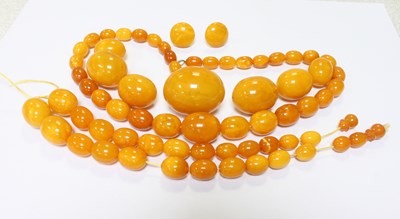 Lot 582 - A collection of amber beads, including a...