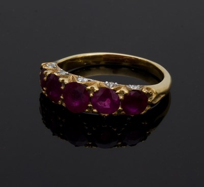 Lot 602 - A ruby and diamond five-stone ring, claw set...