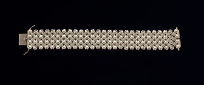 Lot 612 - An 18ct gold strap bracelet, designed as a...