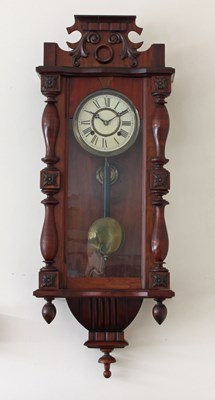 Lot 650 - A walnut Vienna type wall clock with eight-day...