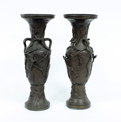 Lot 665 - A pair of bronzed metal vases with birds and...