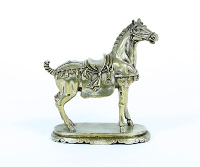 Lot 674 - A Chinese style silvered metal horse, 17cm high