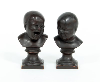 Lot 675 - A pair of earthenware busts of babies, one...