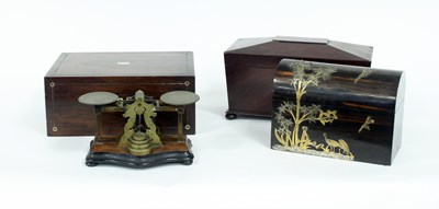 Lot 685 - A mahogany tea caddy and a set of postal...