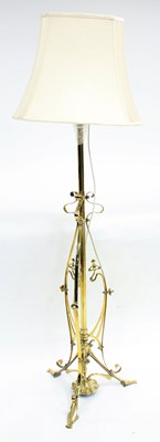 Lot 696 - A brass telescopic standard lamp with scroll...