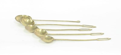 Lot 702 - Four brass ladles with rectangular ends and...