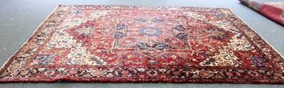 Lot 13 - An Iranian wool carpet, the central medallion...