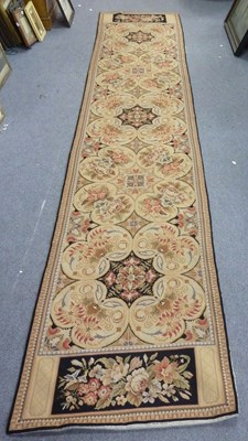 Lot 14 - A needlework runner in the Aubusson style,...