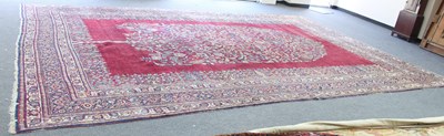 Lot 15 - A south west Persian carpet with crimson...