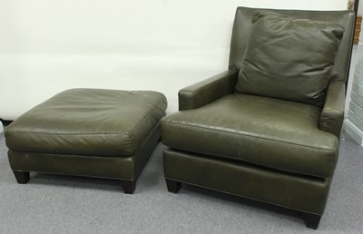 Lot 24 - A modern green leather upholstered armchair...