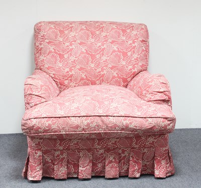 Lot 25 - A modern upholstered armchair in leaf print...